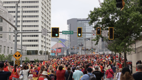 A photo of a huge group of soccer fans going to a match in Atlanta. 