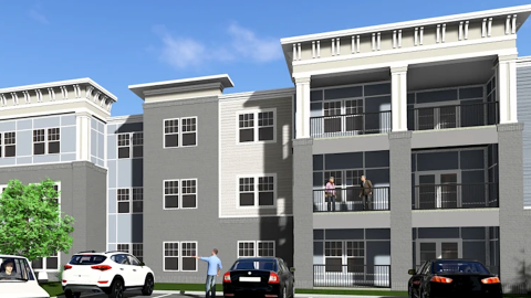 An image of a large new apartment complex site with many buildings under blue skies west of downtown Atlanta near a MARTA station. 