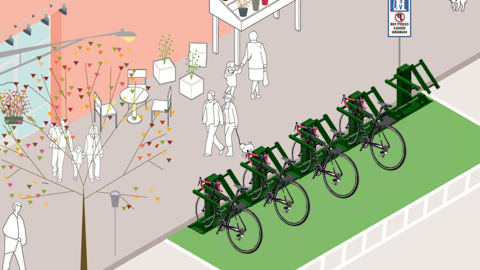 An image of a new bike charging and locking system with bikes parked at it and many trees and buildings nearby. 