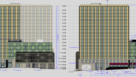 An image of a large tower structure near many smaller buildings in Buckhead Atlanta near wide streets.