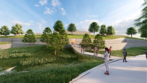 An image of a site where a park with many trails and bridges and seating areas and a large pond is planned, next to many new buildings.
