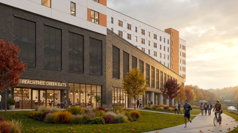 An image of a large new apartment building with retail at the base along a wide walking and biking path near a creek in Atlanta.