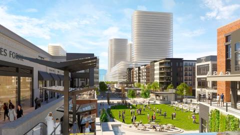 An image of a large new development community with future phase towers shown in the background.
