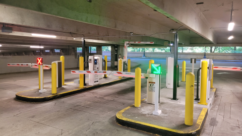 An image of a large parking garage for Atlanta's transit system MARTA with new gates and poles.