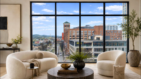 An image of a boutique new condo building in Atlanta's old fourth Ward near wide street and a large brick building.