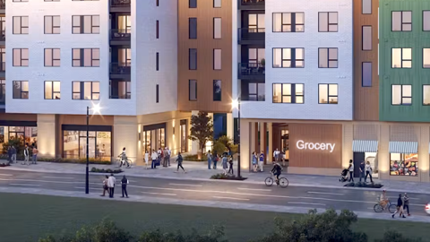 An image showing a large site where a modern-style apartment complex with a grocery store is being built east of Atlanta.