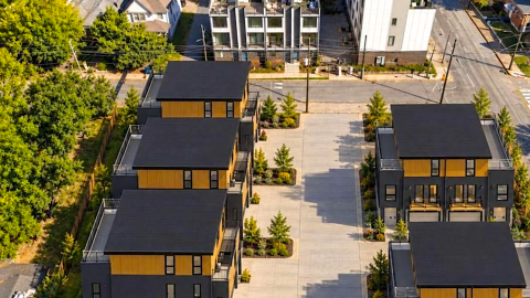 An image of a large corner townhome development site in Atlanta south of downtown near many old houses and newer townhomes.