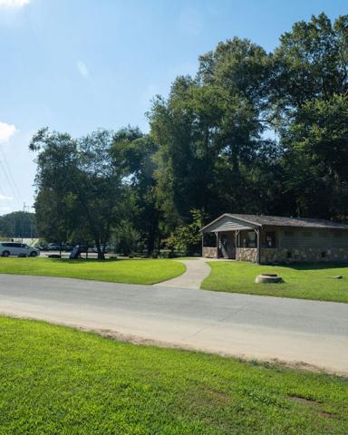 An image of a large greenspace beside a river where a new park is planned.