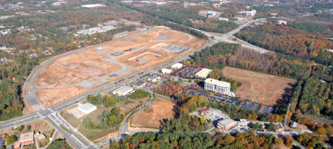 A huge development in north suburban Atlanta shown near many forested areas and big highways.