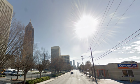  a photo of Midtown Atlanta with many buildings showing how wide streets and perspectives on how many parking lots, vacant parcels have disappeared